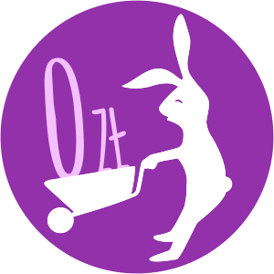 Na zdjęciu znajduje się królik z taczką